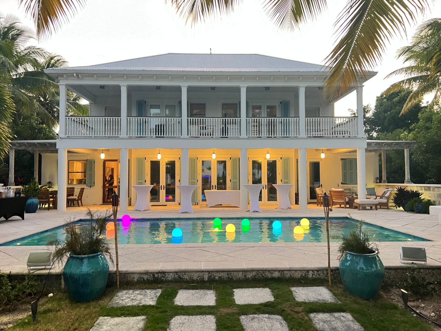 The villa and pool at dusk